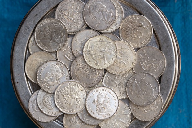 Counterfeit old American coins are sold at local market for tourists in Pushkar, Rajasthan, India